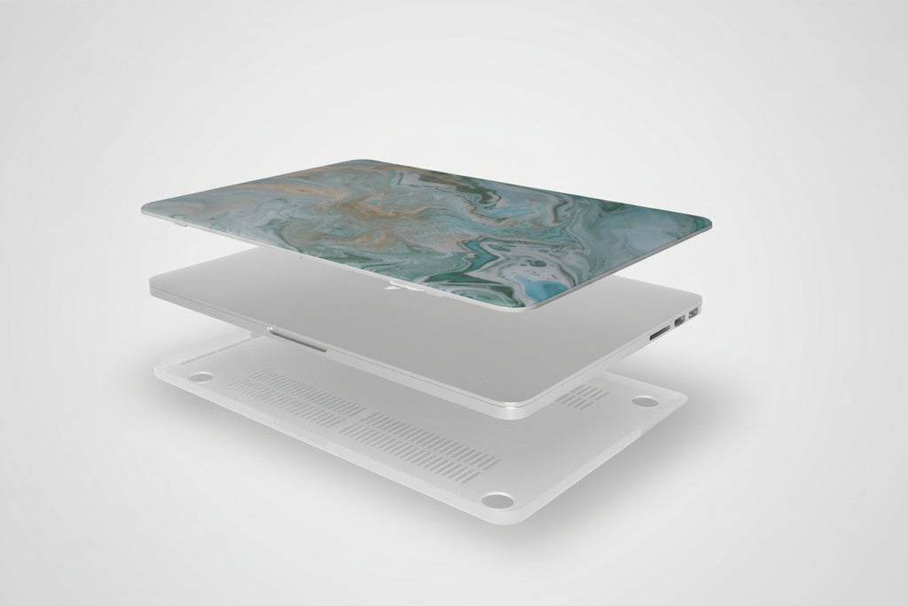 Laptop with a marble-patterned cover on a white background