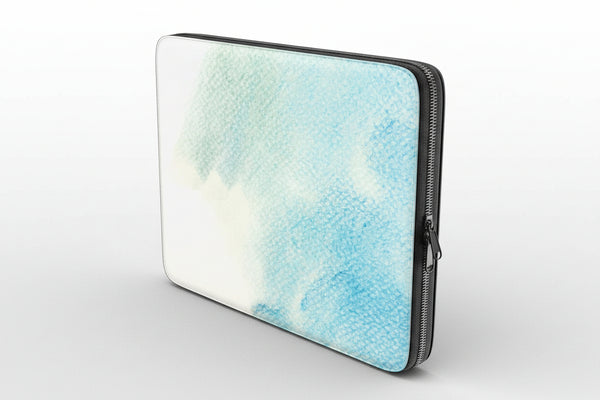 Laptop sleeve with a watercolor design in blue and white on a white background