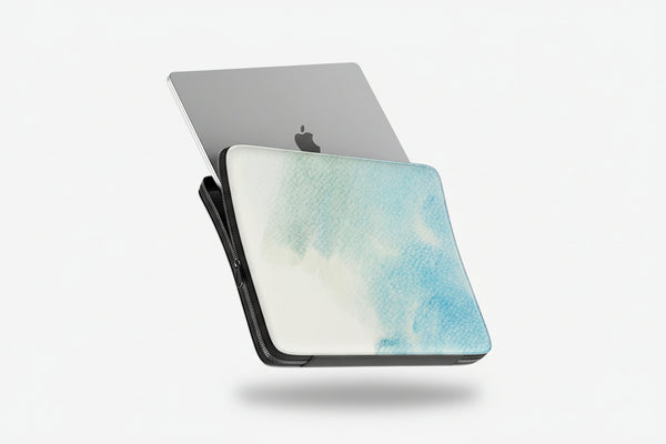 Laptop with a watercolor design case on a white background