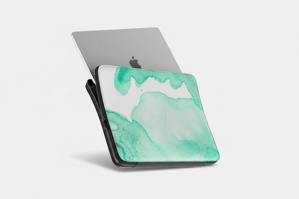 Laptop with a green and white abstract design on a white background