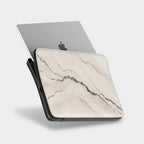Laptop with a marble patterned skin on a white background