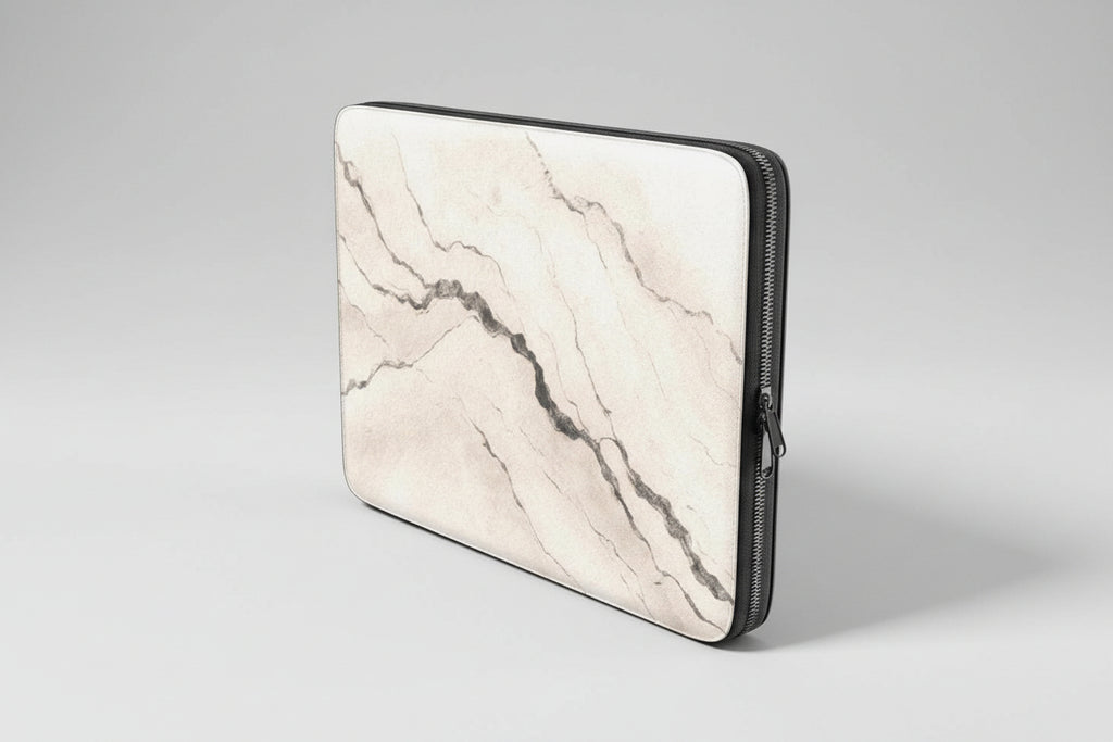 Marble-patterned laptop sleeve with a zipper on a white background